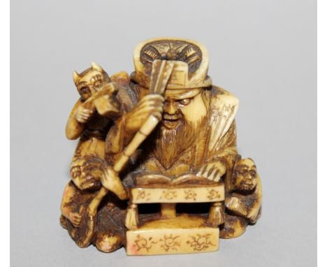 A 19TH CENTURY JAPANESE MEIJI PERIOD STAINED IVORY NETSUKE, unsigned, in the form of a seated Emma-O in the company of three 