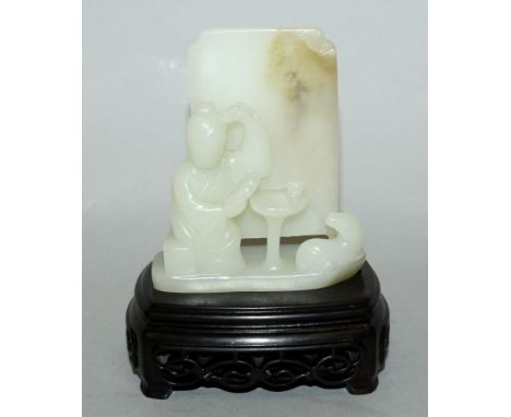  A CHINESE PALE CELADON JADE-LIKE GROUP, together with a fitted wood stand, depicting a seated lady with her dog before a scr