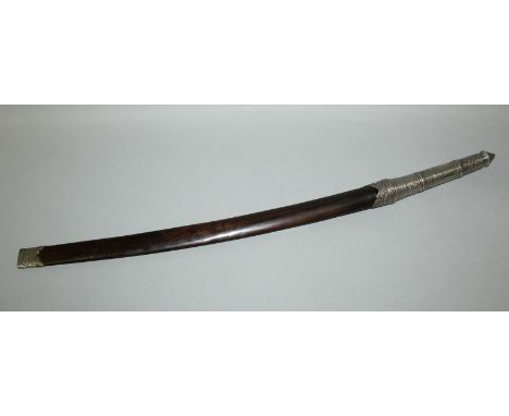 A 19TH/20TH CENTURY BURMESE SILVER-METAL MOUNTED SWORD, with an elaborate multi border hilt, the wood scabbard with embossed 