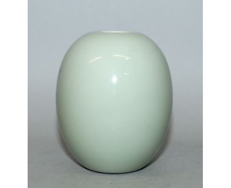 A SMALL CHINESE CELADON PORCELAIN JAR, of oval form with a small neck aperture, the base with a Qianlong seal mark, 3.4in hig