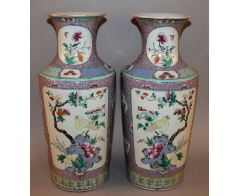 A GOOD LARGE PAIR OF 19TH CENTURY CHINESE FAMILLE ROSE PORCELAIN VASES, each mallet-form body well painted with various panel