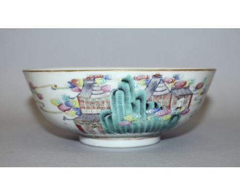 A 19TH/20TH CENTURY CHINESE FAMILLE ROSE PORCELAIN BOWL, the sides painted with a crane borne Immortal and with buildings sup