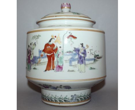 A CHINESE FAMILLE ROSE PORCELAIN JAR WITH INTEGRAL COVER, and a paper label, the sides decorated with ladies and boys in a fe