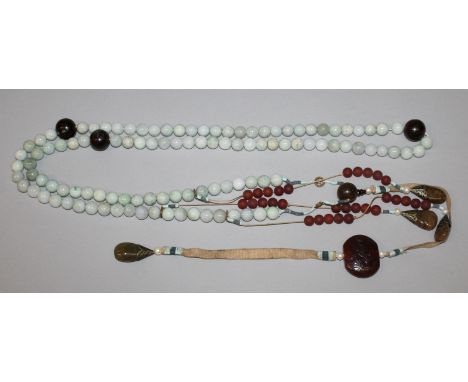 A CHINESE JADE-LIKE COURT NECKLACE, with numerous spherical beads and hanging stones, each spherical bead 0.6in diameter.