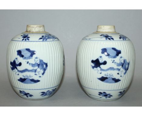 A PAIR OF CHINESE BLUE & WHITE PORCELAIN RIBBED JARS, each decorated with medallion panels of playing boys, each short neck u