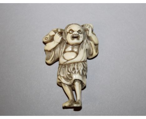 A GOOD QUALITY 18TH CENTURY JAPANESE IVORY NETSUKE OF GAMMA SENNIN, unsigned, bearing two toads on his leaf-shrouded shoulder