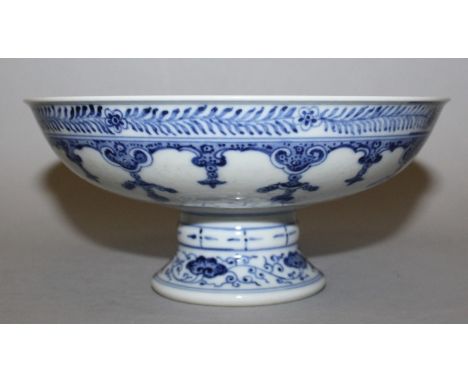 A CHINESE BLUE & WHITE PORCELAIN STEM BOWL, the interior decorated with formal designs of scroll and leaf stemmed peony, the 