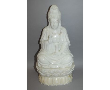 A LARGE CHINESE WHITE JADE-LIKE FIGURE OF GUANYIN, seated in meditation on a double lotus plinth, one hand raised in benedict