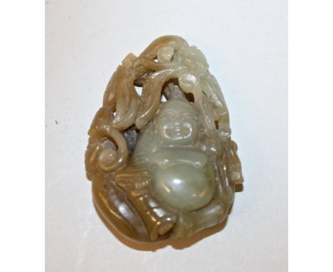 A GOOD 19TH CENTURY CHINESE JADE CARVING OF BUDAI, seated on his bag and holding an extended frond of pierced lingzhi, upon w