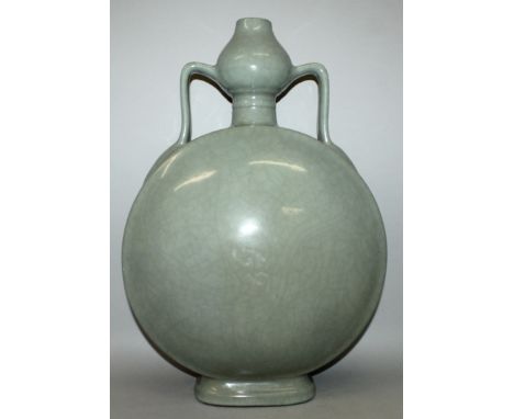 A LARGE CHINESE CELADON PORCELAIN MOON FLASK, unusually with a garlic neck, the sides applied with an even crackled glaze, th