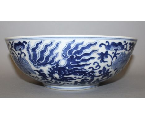 A CHINESE BLUE & WHITE PORCELAIN PHOENIX BOWL, decorated with a formal design of phoenix amidst scroll-stemmed foliage, the b