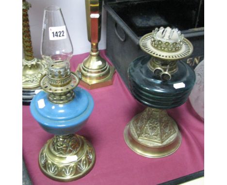 A Late XIX Century Oil Lamp, with a glass shade, glass well, brass base, together with one other oil lamp.(2)
