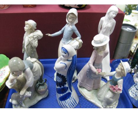 A Lladro Model 'Caress and Rest', three Nao models, a Royal Doulton 'Tomorrow's Dreams', and a USSR figure:- One Tray