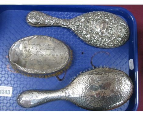 A Hallmarked Silver Backed Hand Mirror; together with two brushes. (3)