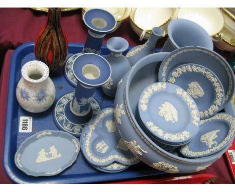 A Collection of Wedgwood Jasperwares in blue: pair of candlesticks pedestal fruit bowl, vases, pin trays etc; Poole vases. On