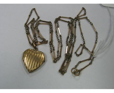 A Long Fancy Link Chain, suspending engine turned heart shape locket pendant.