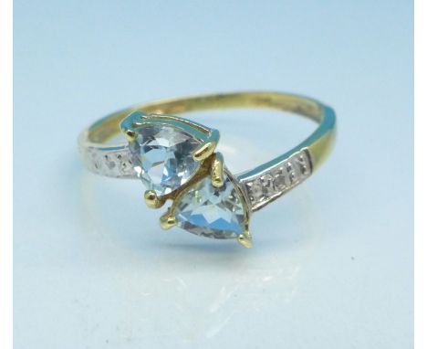 A 9ct gold, blue topaz and diamond ring, 1.3g, P
