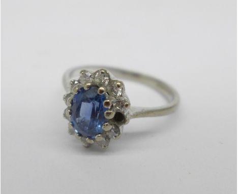 An 18ct white gold, sapphire and diamond cluster ring, lacking one diamond, 3g, K, - Note, this lot attracts VAT