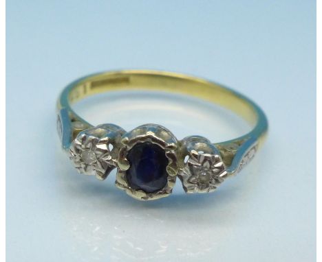 An 18ct gold, platinum set diamond and black stone ring, 3.4g, O