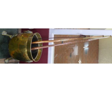 A brass coal bucket and two copper hunting horns