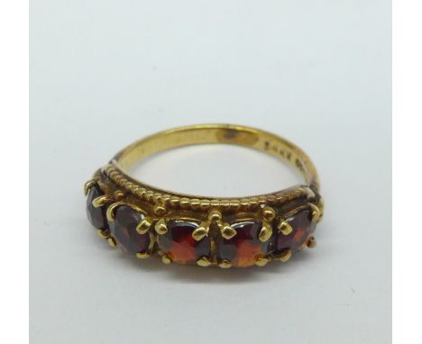 A 9ct gold and five stone garnet ring, 2.5g, J