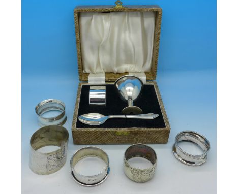 A plated Christening set, four silver napkin rings, 66g, and a plated napkin ring