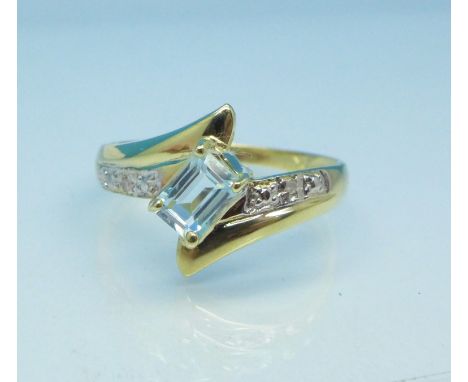 A 9ct gold, blue topaz and diamond ring, 1.3g, O