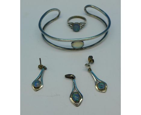 Silver and opal set jewellery; a bangle, earrings and matching pendant and a ring, (4)