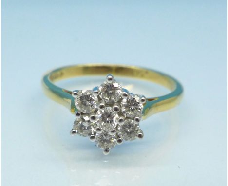 An 18ct gold and diamond cluster ring, 0.5 carat diamond weight, 2.5g, L