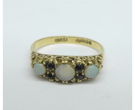 A 9ct gold, opal and sapphire ring, 2.2g, N