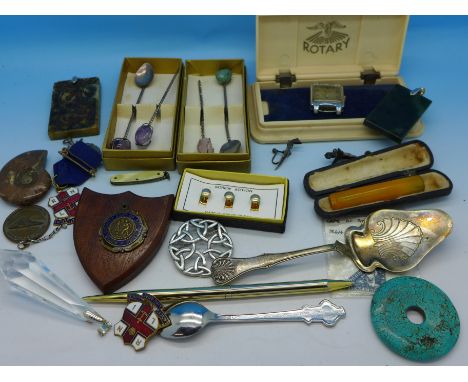 A Bakelite Rotary wristwatch box, Rolex spoon, gem set spoons, medallions, etc.