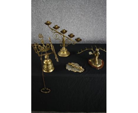 A mixed collection of brassware including a candle holder, knocker and stags head. H.37cm. (largest) 