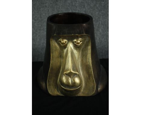 A gold finished baboon head planter. Poly-resin. H.27cm. 
