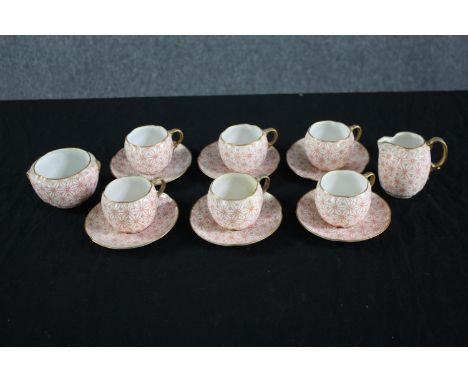 Grainger's Worcester Porcelain. Six cups and saucers, one creamer, and a sugar bowl. Each with a hand painted orange geometri