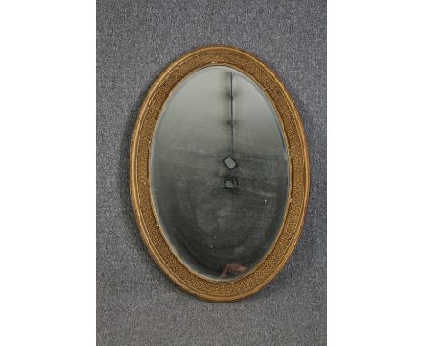 A C.1900 gilt framed mirror with bevelled plate. H.96 W.66cm. 