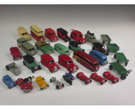 Quantity of unboxed Dinky Toys including postal vans, Trojan 'Esso' van, bus, coaches, motorcycle, trailers, fire engine, etc