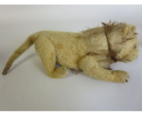 A Steiff fully jointed Lion with glass eyes and button in ear, Steiff monkey and plush zebra, miniature bear and three skin c