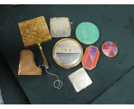 A shagreen Compact with enamelled military badge, a white metal with flower and leaf design, Duplux cigarette case with woven
