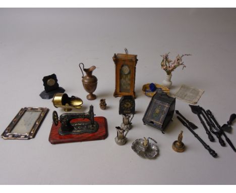 A German tinplate penny toy doll's house Sewing Machine with gilt flower pattern to base, a hanging wall clock, tinplate coal
