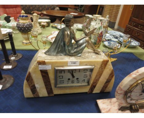 An Art Deco French Mantel Clock with metal girl and bird surmount above rectangular dial in cream and brown marble case, 17in