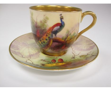 A Royal Worcester small Cup and Saucer painted peacocks on a fruiting branch, signed Austin on saucer, puce mark