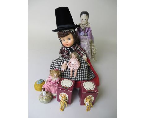 A South German turned wooden Doll circa 1880, 10 1/2in H, two all bisque dolls and a baby, small pincushion doll, two Steiff 