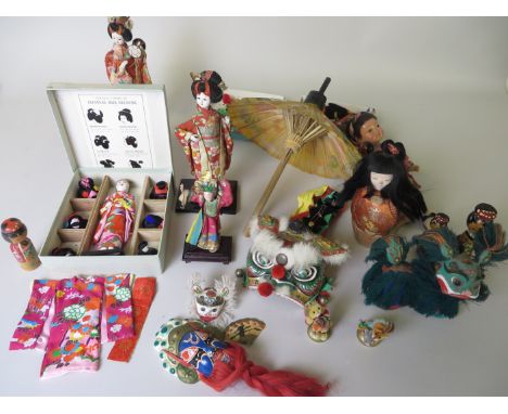A doll's Japanese Parasol 1930's, doll with six wigs, dragon glove puppet, masks, box chenille birds, etc. All Japanese.