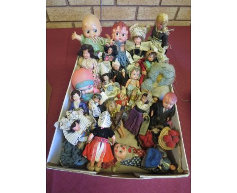 A Japanese made celluliod Kewpie with blue neck wings, 9 1/2in H, a marcel waved flapper, three small Christmas tree versions