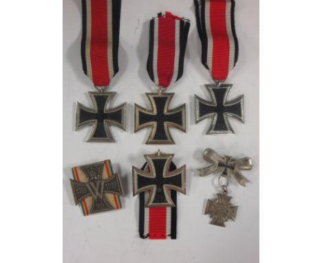 A Silver Cross on Iron Cross bow 1868, a 1788-1913 Cross on ribbon and four 1939 Second Class Iron Crosses (6)(no guarantee o