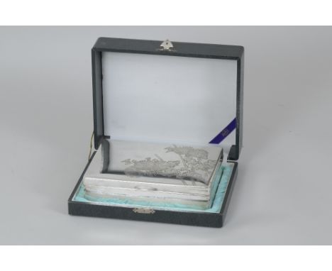 A Japanese silver Cigar Box with flowering shrub engraving, 8in, in original case