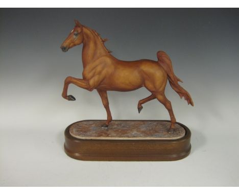 A Royal Worcester model of an American Saddleback Horse in a trotting pose, modelled by Doris Lindner, limited edition 189/75