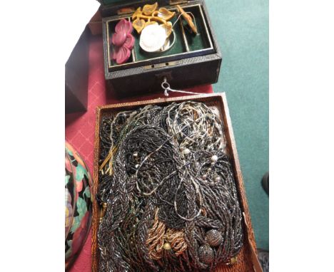 A group of multi-string bugle bead Necklaces in darker colours and a jewel box containing a horn necklace, etc