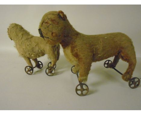 A Steiff Fawn and  brown Bulldog on a metal wheeled base and a Steiff Sheep. Both A/F. Circa 1910