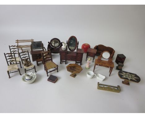 A fine 1920's dolls house Dressing Table, bedside table, three other dressing tables, three dining chairs, sofa, jug and basi